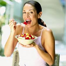 lady eating bowl fruit