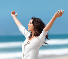 woman vibrant arms in air