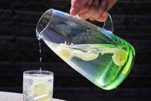 pitcher of water pouring into glass